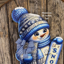 Load image into Gallery viewer, Christmas Snowman door hanger for Winter, Blue and white Snowman with scarf and hat, front door wreath, cute Wooden Snowman let it snow sign