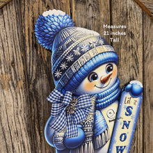Load image into Gallery viewer, Christmas Snowman door hanger for Winter, Blue and white Snowman with scarf and hat, front door wreath, cute Wooden Snowman let it snow sign
