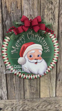Load and play video in Gallery viewer, Front door hanger for Christmas, Christmas Farmhouse door decor, Wood round Christmas sign, Christmas gift, Wood Santa decor, Santa wreath
