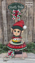Load and play video in Gallery viewer, Elf Decoration for Christmas, Baking elf girl, North Pole sign, Farmhouse wooden elf with sign, Gingerbread decor, Holiday elf centerpiece

