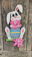 Load and play video in Gallery viewer, Spring Bunny Wreath, Front door hanger for Easter, Spring Farmhouse Easter decor, bunny with floppy ears, Wooden door hanger, Bunny decor,
