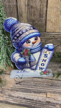 Load and play video in Gallery viewer, Wooden Snowman decoration, Snowman table sitter on base, blue and white Christmas, Winter tiered tray decor, let it snow sign, hat and scarf
