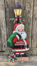 Load and play video in Gallery viewer, Santa Clause Decoration, Christmas centerpiece, Primitive Santa decor, Christmas Porch decor, Wooden Santa with North pole sign, Candy decor
