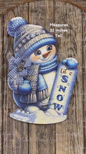 Load and play video in Gallery viewer, Christmas Snowman door hanger for Winter, Blue and white Snowman with scarf and hat, front door wreath, cute Wooden Snowman let it snow sign
